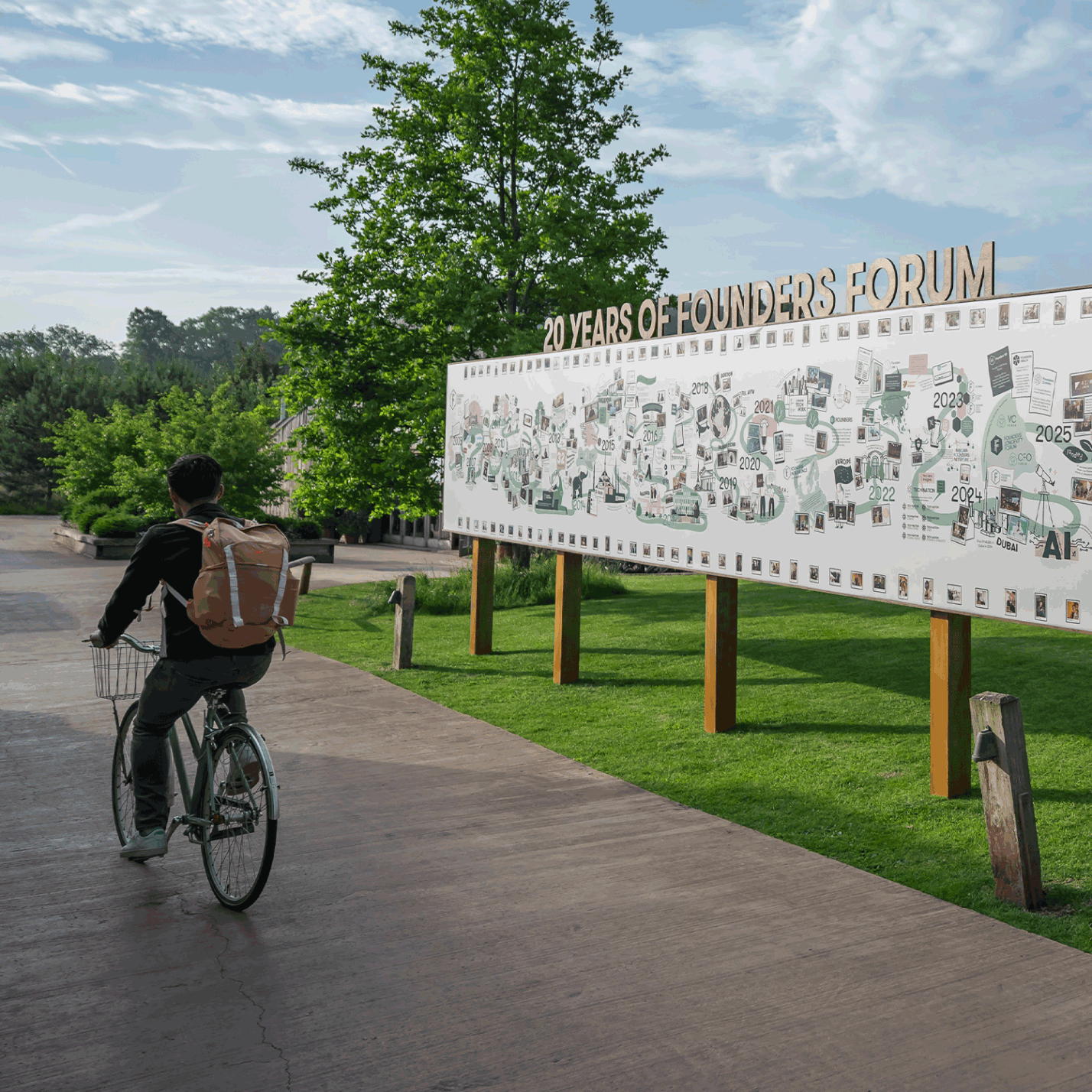 Illustrated timeline mural for Founders Forum shown as a large-scale outdoor installation