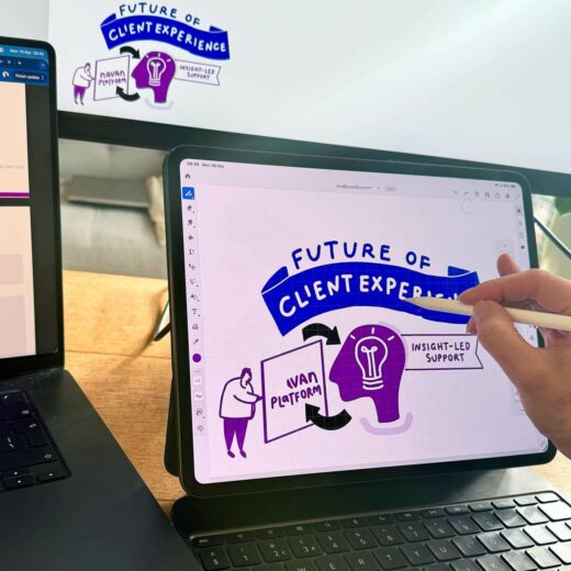 Remote live scribing in progress, live scribe drawing on a tablet while visuals are screen-shared on a monitor during a virtual event